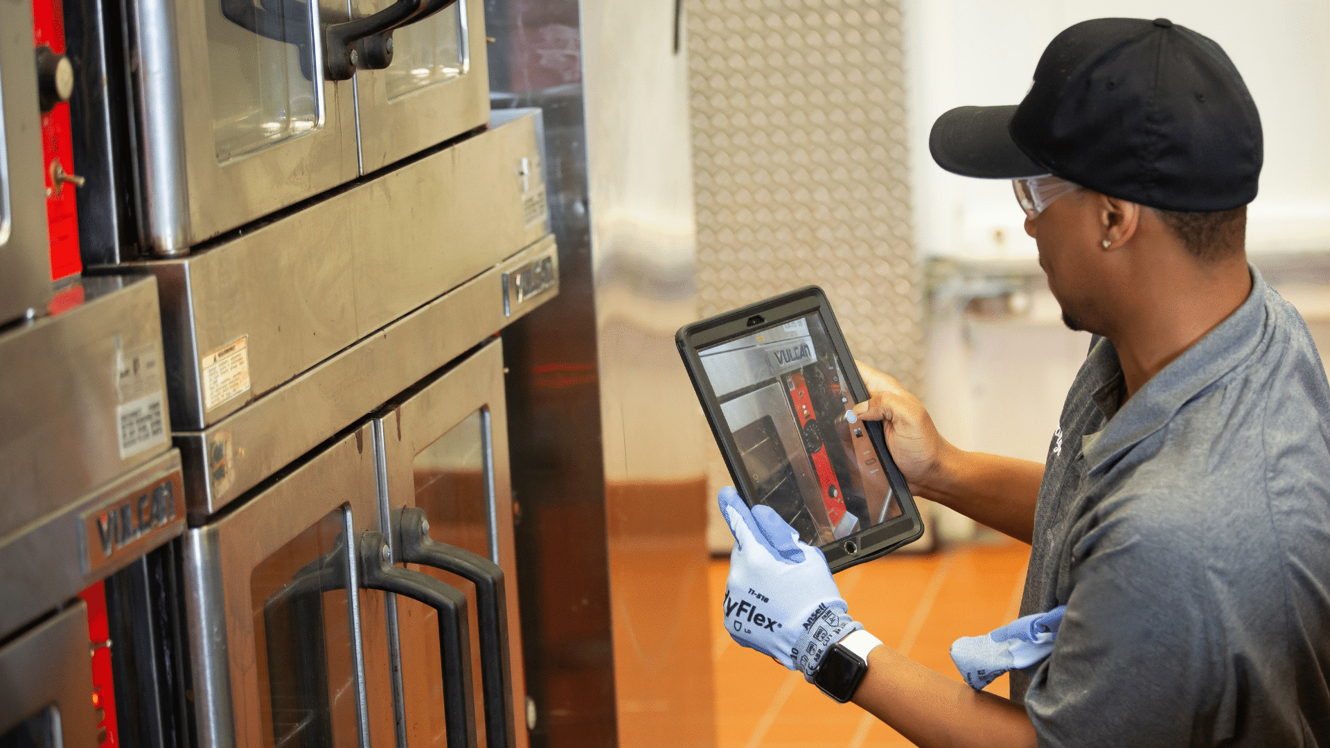 employee taking photo of equipment