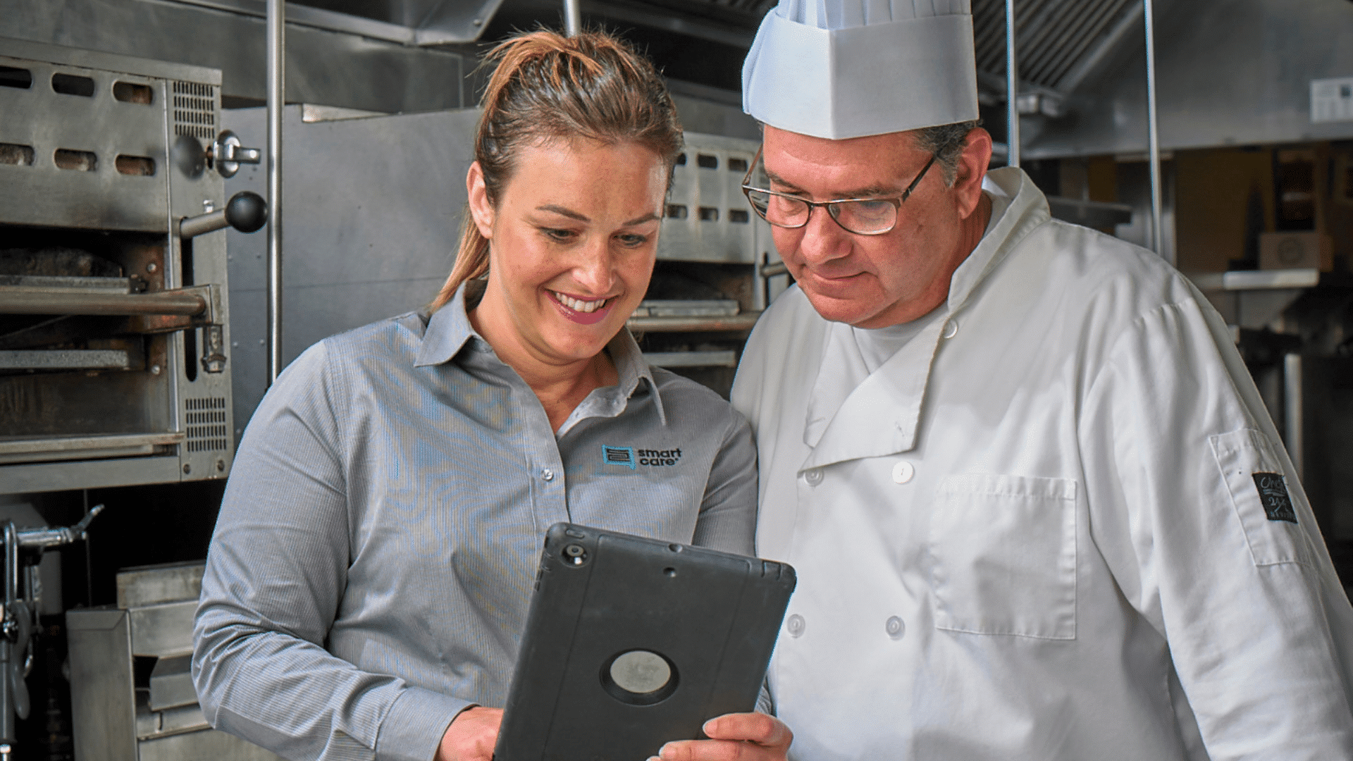 Technician reviewing findings with chef